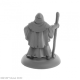 Brother Hammond from the Dark Heaven Legends metal range by Reaper Miniatures sculpted by Bobby Jackson. Holding a wooden staff in one hand and a book tucked under his other arm Brother Hammond has the hood of his robe up and walks barefoot