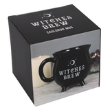 a box containing Witches Brew Cauldron Mug, a black mug in the shape of a cauldron with a moon, starts and the words Witches Brew written in white 