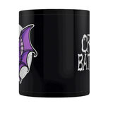A black mug featuring a cute purple bat flying in front of a full moon and the words Crazy Bat Lady 