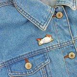 Cat In Nature enamel pin badge with two butterfly clutch fastenings. A white cat asleep amongst the flowers and toadstools for your clothing, bag, hat