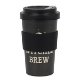 travel mug in a stippled black colour with a crescent moon and star design and the words 'Witches Brew', topped with a black lid and black sleeve