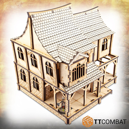 An MDF tavern for your gaming table from TT Combat. This kit lets you build a steep pitched roofed and angled wall tavern in which each section can be removed and the interior is fully playable.