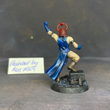 A sorcerer painted by Mrs MLG. This resin printed miniature is in the style of the hero quest sorcerer, painted with blue clothing and red headdress.  