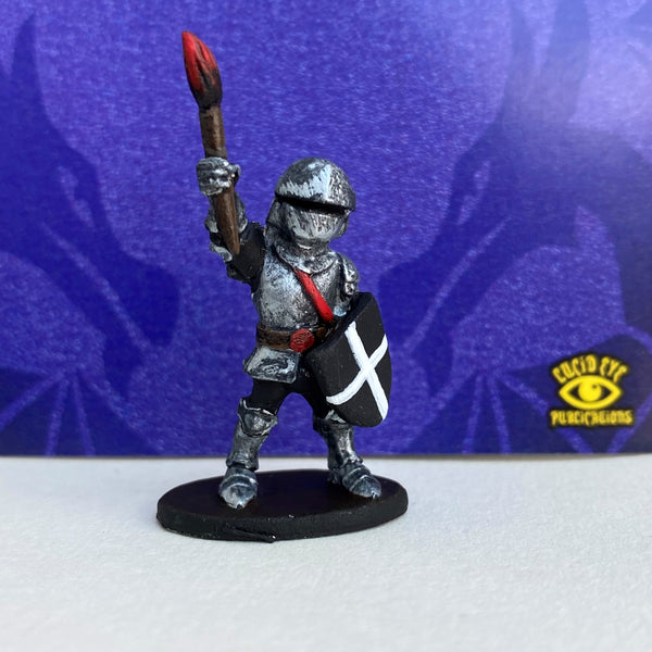 MLG Mascot Mini, Sir Lance. Metal miniature of a knight holding a shield and a paint brush