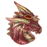 A red and gold dragon head with green eyes incense burner 