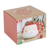 The box for  A rounded mug with Santa face design and red and white stripe handle with a pair of red and green stripped fluffy socks