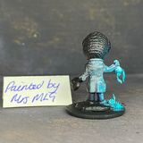 A Reaper Miniatures bonesylvanian Jaques hand painted by Mrs MLG. This scientist may have taken his experiments too far as he now has the head and one hand of a bug. Mrs MLG has painted this little fella with his glass flask broken and the contents spilling out onto the floor. 