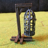 A 28mm scale large Torture Cage from Iron Gate Scenery printed in PLA with one stand, one skeleton and one large cage for your dungeon setting, RPGs, tabletop games and more hobby and gaming needs.