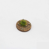 Spring 6mm tufts by Geek Gaming Scenics, shown here in a base with sand and rocks