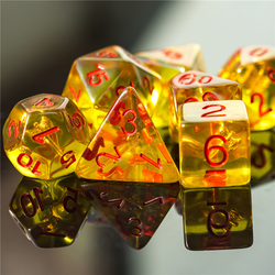 RPG character dice,  yellow character class dice, with red numbers and an axe shape in each one
