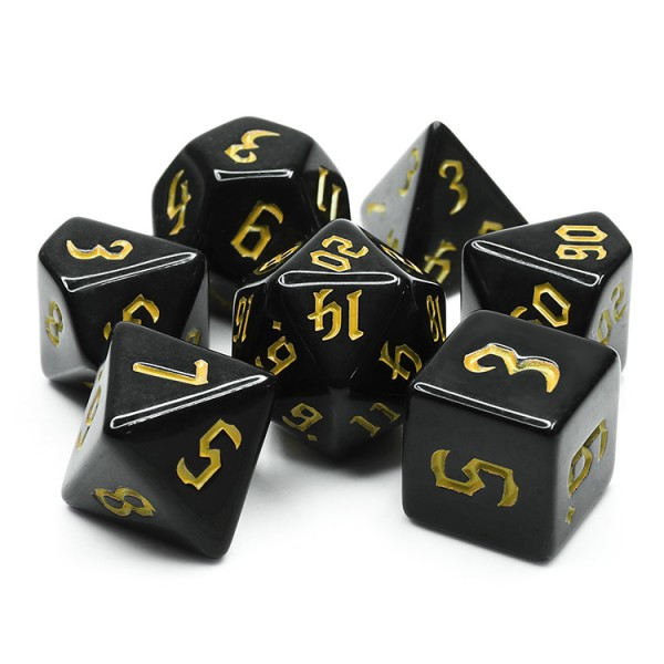opaque Chaos Chondrite RPG dice in black with gold yellow chaos numbers. RPG D20 dice set 