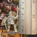 Alone in the Dark by Northumbrian Tin Solider holds a torch in one hands and a sword in the other, wearing chainmail and plate armour. with a ruler