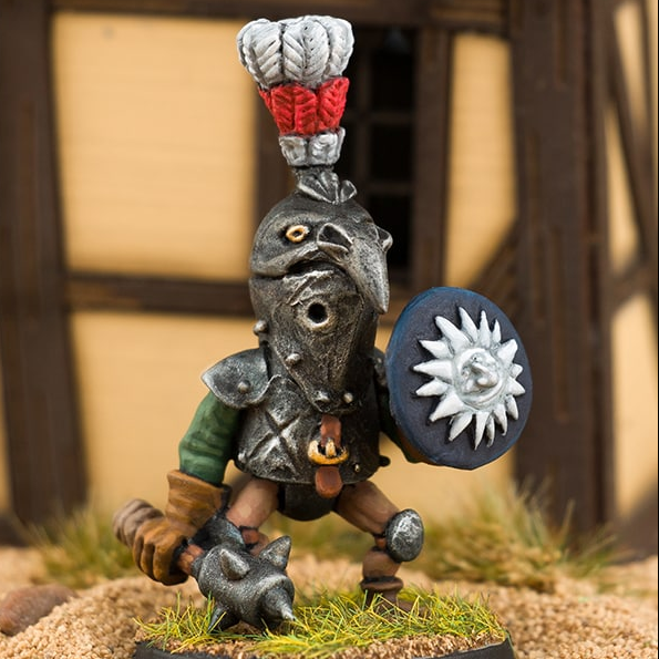 The Raven by Northumbrian Tin Solider a metal miniature for your gaming table holding a mace in one hand, a round shield in the other, a beaked shaped helmet and large feather adornment.