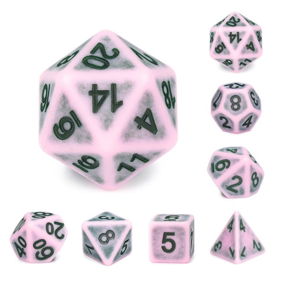 Weathered ancient Single Notes Pink RPG dice set. These interesting dice have a baby pink colouring and black numbers. RPG D20 dice set 