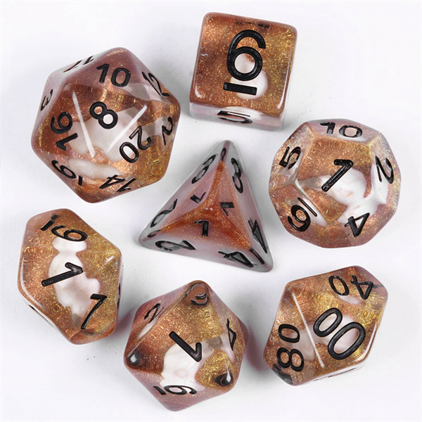 Skull Bird Head poly RPG dice.  These unusual dice have black numbers and contain a white bird skull shape upon a bed of gold shimmer